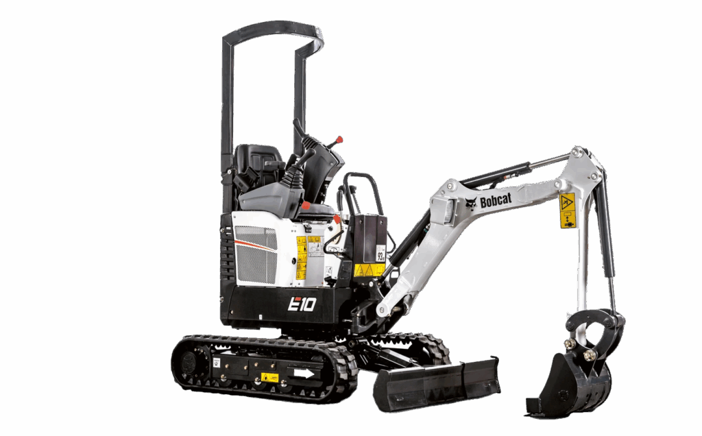 Bobcat E10 compact excavator positioned in a tight workspace with bucket lowered.